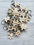 Student class keyrings puzzle pieces with a star