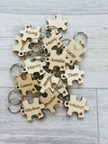 Student class keyrings puzzle pieces with a star